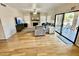 Gathering room with stone fireplace and sliding glass doors at 938 W Iris Dr, Gilbert, AZ 85233