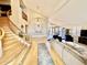 Spacious living area with hardwood floors and a staircase at 938 W Iris Dr, Gilbert, AZ 85233