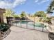 Relaxing pool with safety fence and stone patio at 938 W Iris Dr, Gilbert, AZ 85233