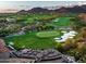 Aerial view of the golf course and surrounding landscape at 10163 E Hualapai Dr # 2917, Scottsdale, AZ 85255