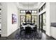 Bright dining room features a round table with black leather chairs and a stylish rug at 10163 E Hualapai Dr # 2917, Scottsdale, AZ 85255