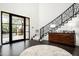 Bright entryway with modern staircase and custom wood cabinet at 10163 E Hualapai Dr # 2917, Scottsdale, AZ 85255