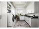 Bright laundry room with white cabinets, washer, dryer, and a window offering natural light at 10163 E Hualapai Dr # 2917, Scottsdale, AZ 85255