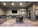 Luxury outdoor kitchen with stainless steel appliances and granite countertops at 10163 E Hualapai Dr # 2917, Scottsdale, AZ 85255