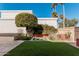 Landscaped backyard with artificial turf and desert plants at 10473 N 87Th Pl, Scottsdale, AZ 85258