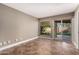 Bedroom with tile floors and sliding glass doors to patio at 10473 N 87Th Pl, Scottsdale, AZ 85258