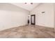 Spacious bedroom with tile floors and access to bathroom at 10473 N 87Th Pl, Scottsdale, AZ 85258