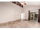 Bright bedroom with tile floors and sliding glass door to patio at 10473 N 87Th Pl, Scottsdale, AZ 85258