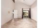 Bright bedroom with tile floors and sliding glass door to patio at 10473 N 87Th Pl, Scottsdale, AZ 85258