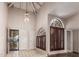 Bright entryway with tile floors, high ceilings, and elegant chandelier at 10473 N 87Th Pl, Scottsdale, AZ 85258