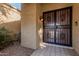 Front door entrance with security gate at 10473 N 87Th Pl, Scottsdale, AZ 85258