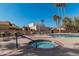 Community hot tub near the pool and lounge chairs at 10473 N 87Th Pl, Scottsdale, AZ 85258