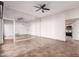 Spacious living room with tile floors and mirrored wall at 10473 N 87Th Pl, Scottsdale, AZ 85258