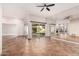 Living room with tile floors, sliding doors, and fireplace at 10473 N 87Th Pl, Scottsdale, AZ 85258