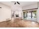 Living area with tile floors and sliding glass doors to patio at 10473 N 87Th Pl, Scottsdale, AZ 85258