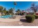 Community pool with tables, umbrellas, and a gazebo at 10473 N 87Th Pl, Scottsdale, AZ 85258