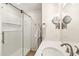 Clean bathroom with walk-in shower and updated vanity at 10529 W Palmeras Dr, Sun City, AZ 85373