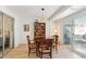 Cozy dining area with wooden table and chairs, near bedroom and patio access at 10529 W Palmeras Dr, Sun City, AZ 85373