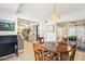 Bright dining area with wooden table and chairs, offering access to the kitchen and patio at 10529 W Palmeras Dr, Sun City, AZ 85373