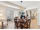 Bright dining area with wooden table and chairs, offering access to the patio at 10529 W Palmeras Dr, Sun City, AZ 85373