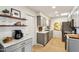 Modern kitchen with gray cabinets and marble countertops at 10529 W Palmeras Dr, Sun City, AZ 85373