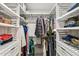 Spacious walk-in closet with ample shelving and hanging space at 10529 W Palmeras Dr, Sun City, AZ 85373