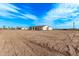 Aerial view of new construction home and surrounding desert lot at 10662 S 297Th Ave, Palo Verde, AZ 85343