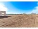 Large backyard of new construction home with distant mountain views at 10662 S 297Th Ave, Palo Verde, AZ 85343