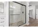 Elegant bathroom with a frameless glass shower and marble tile at 10662 S 297Th Ave, Palo Verde, AZ 85343