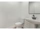 Small bathroom with pedestal sink, toilet and mirror at 10662 S 297Th Ave, Palo Verde, AZ 85343