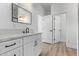 Clean bathroom, featuring a white vanity with black hardware and a large mirror at 10662 S 297Th Ave, Palo Verde, AZ 85343