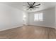 Bedroom with ensuite bathroom and wood-look floors at 10662 S 297Th Ave, Palo Verde, AZ 85343