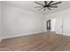 Bright bedroom with ceiling fan and wood-look floors at 10662 S 297Th Ave, Palo Verde, AZ 85343