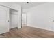 Simple bedroom with wood-look floors and spacious closet at 10662 S 297Th Ave, Palo Verde, AZ 85343