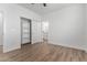 Bedroom with a built-in shelving unit and bathroom access at 10662 S 297Th Ave, Palo Verde, AZ 85343