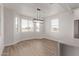 Bright dining area with large window and modern light fixture at 10662 S 297Th Ave, Palo Verde, AZ 85343