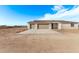 New construction home with two-car garage and desert landscaping at 10662 S 297Th Ave, Palo Verde, AZ 85343