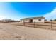 New single-story home with three-car garage and desert landscaping at 10662 S 297Th Ave, Palo Verde, AZ 85343