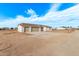 New single-story home with three-car garage and desert landscaping at 10662 S 297Th Ave, Palo Verde, AZ 85343