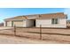 New single-story home with three-car garage and desert landscaping at 10662 S 297Th Ave, Palo Verde, AZ 85343