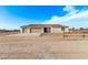 New single-story home with three-car garage and desert landscaping at 10662 S 297Th Ave, Palo Verde, AZ 85343