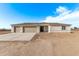 New construction home exterior with a two-car garage at 10662 S 297Th Ave, Palo Verde, AZ 85343