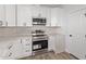 Modern kitchen with white shaker cabinets and stainless steel appliances at 10662 S 297Th Ave, Palo Verde, AZ 85343