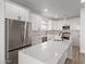 Modern kitchen with white shaker cabinets, quartz countertops, and stainless steel appliances at 10662 S 297Th Ave, Palo Verde, AZ 85343