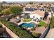 Luxury backyard oasis with pool, spa, and solar panels at 10724 S Mustang Dr, Goodyear, AZ 85338