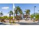 Entrance to Goodyear Ballpark with palm trees and baseball bat sculpture at 10724 S Mustang Dr, Goodyear, AZ 85338