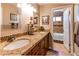 Bathroom with granite countertops and double sinks at 10724 S Mustang Dr, Goodyear, AZ 85338