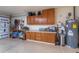 Garage workshop with cabinets, workbench, and storage at 10724 S Mustang Dr, Goodyear, AZ 85338