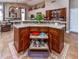 Kitchen island with granite countertop, storage drawers and a large prep area at 10724 S Mustang Dr, Goodyear, AZ 85338