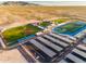 Aerial view of school sports complex with baseball, football, and track at 10724 S Mustang Dr, Goodyear, AZ 85338